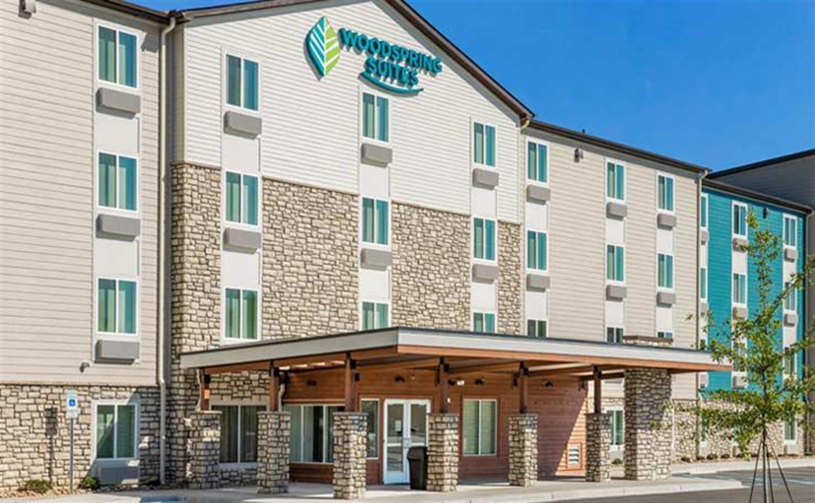 WOODSPRING-SUITES-GREENVILHAYWOOD-EXTENDED-STAY-HOTEL-EXTERIOR-DAY-2-738X456_800